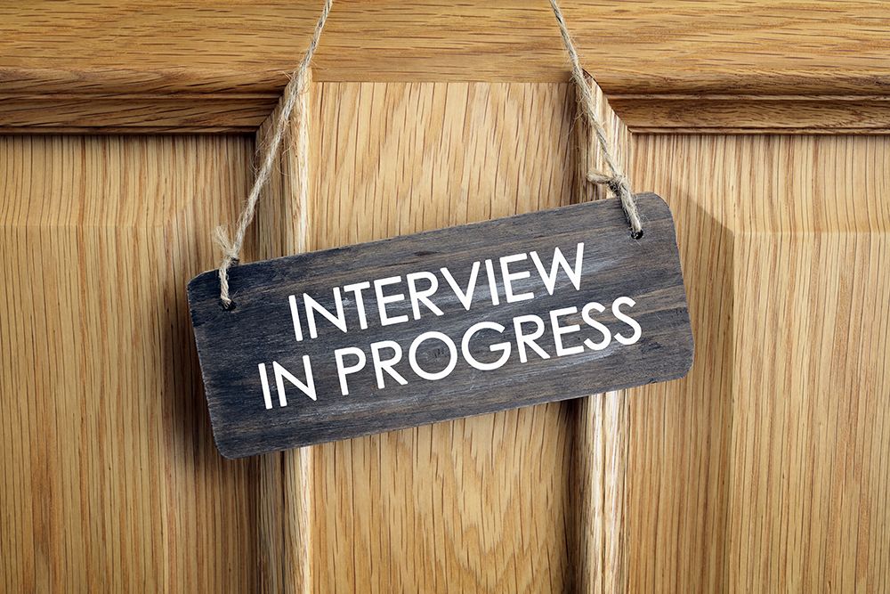 Interview in progress sign on door