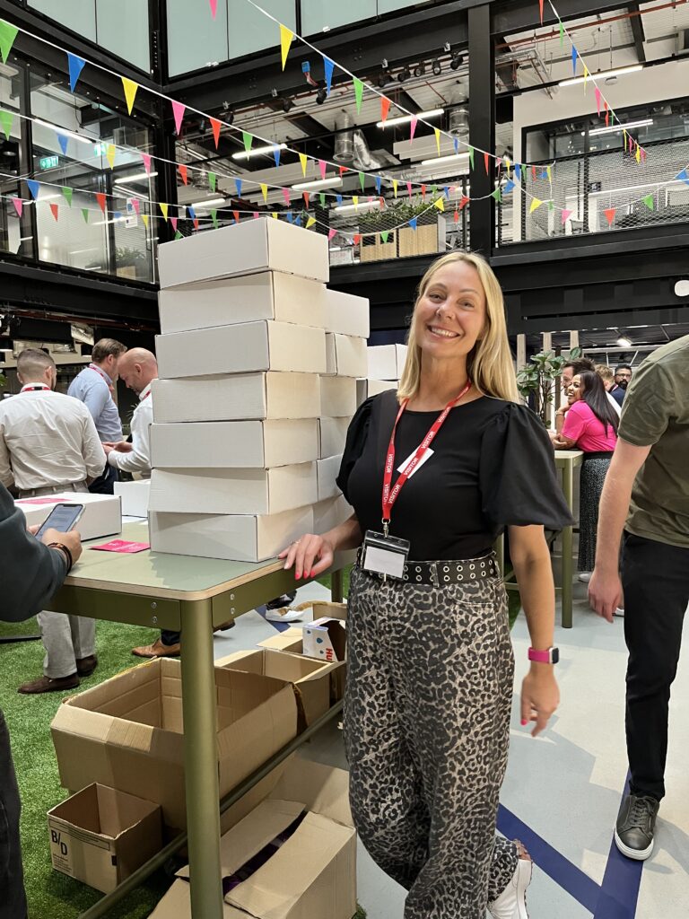 Aquent's Emmeline Shadrach makes Care Packs at Allegis charity event, July 2025
